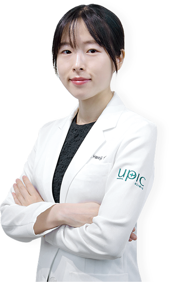 Dr. Haeji, a doctor at UPIC Clinic, in a white coat with arms crossed, representing the doctors at the clinic.
